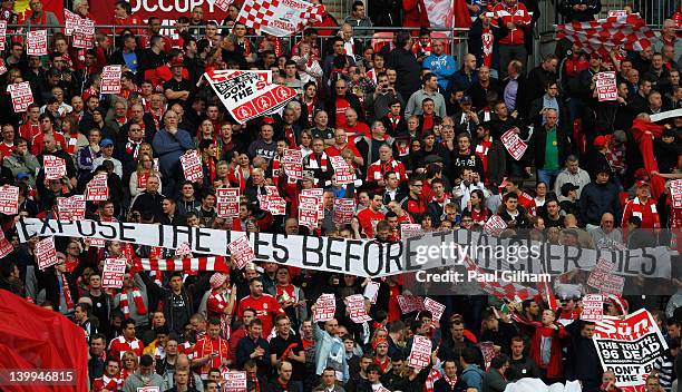 Liverpool fans hold banners protesting against The Sun newspaper prior to the Carling Cup Final match between Liverpool and Cardiff City at Wembley...
