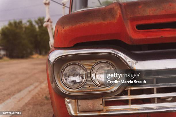 headlights and grill of vintage red pick up truck - old truck stock pictures, royalty-free photos & images