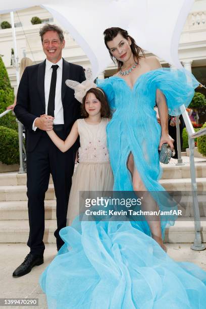 Paul W. S. Anderson, Dashiel Anderson and Milla Jovovich arrive at the amfAR Cannes Gala 2022 at Hotel du Cap-Eden-Roc on May 26, 2022 in Cap...