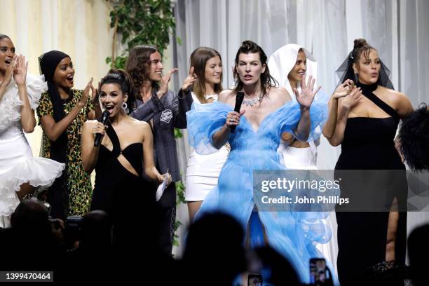 Eva Longoria, Milla Jovovich and models stand in the fashion show during the amfAR Cannes Gala 2022 at Hotel du Cap-Eden-Roc on May 26, 2022 in Cap...