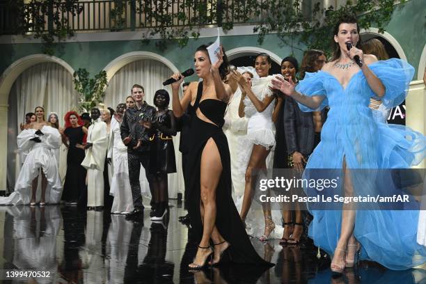 Eva Longoria, Milla Jovovich and models stand in the fashion show during the amfAR Cannes Gala 2022 at Hotel du Cap-Eden-Roc on May 26, 2022 in Cap...