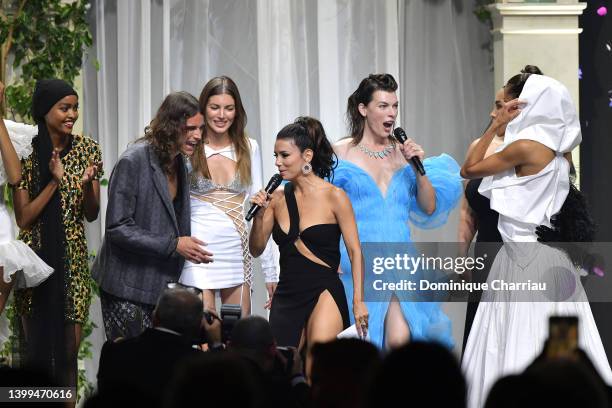 Eva Longoria, Milla Jovovich and models stand in the fashion show during the amfAR Cannes Gala 2022 at Hotel du Cap-Eden-Roc on May 26, 2022 in Cap...