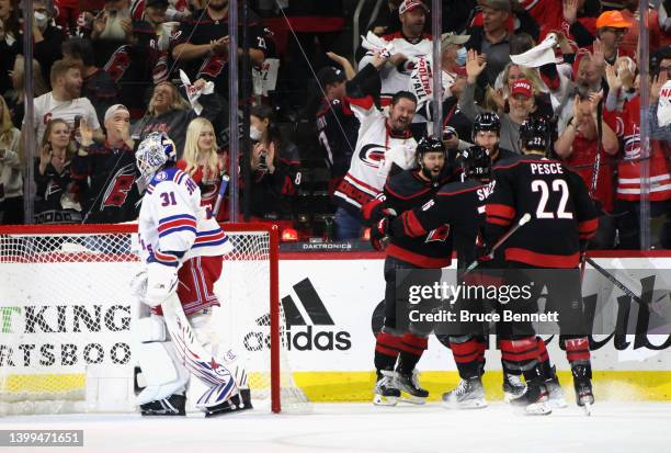 The Carolina Hurricanes celebrate a shorthanded goal by Vincent Trocheck against the New York Rangers during the first period in Game Five of the...