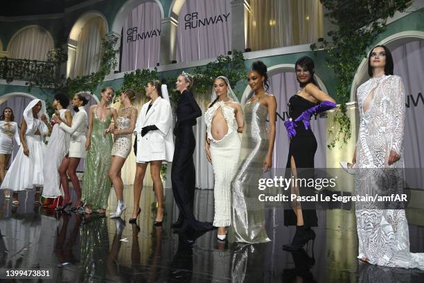 Models walk the runway in the fashion show during the amfAR Cannes Gala 2022 at Hotel du Cap-Eden-Roc on May 26, 2022 in Cap d'Antibes, France.