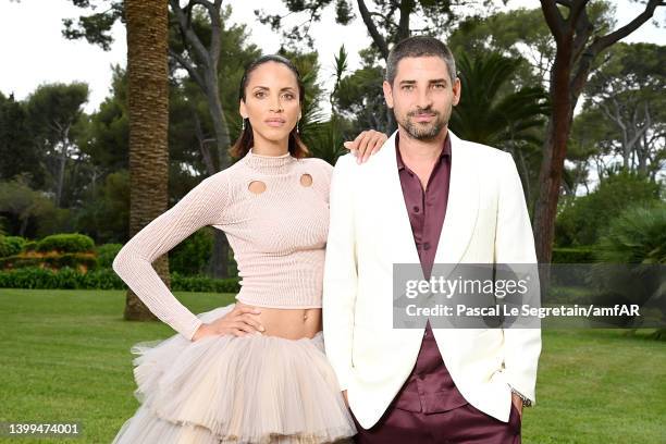 Noémie Lenoir and guest pose during the amfAR Cannes Gala 2022 at Hotel du Cap-Eden-Roc on May 26, 2022 in Cap d'Antibes, France.