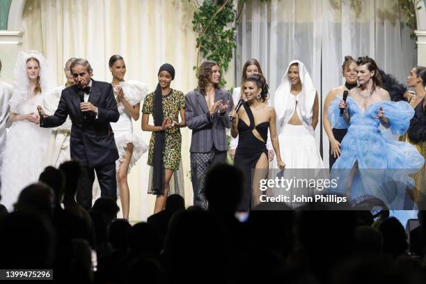 Simon de Pury, Eva Longoria, Noémie Lenoir on stage after the fashion show during the fashion show during the amfAR Cannes Gala 2022 at Hotel du...
