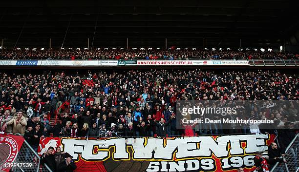 Twente fans watch the action during the Eredivisie match between FC Twente and FC Utrecht at De Grolsch Veste Stadium on February 26, 2012 in...
