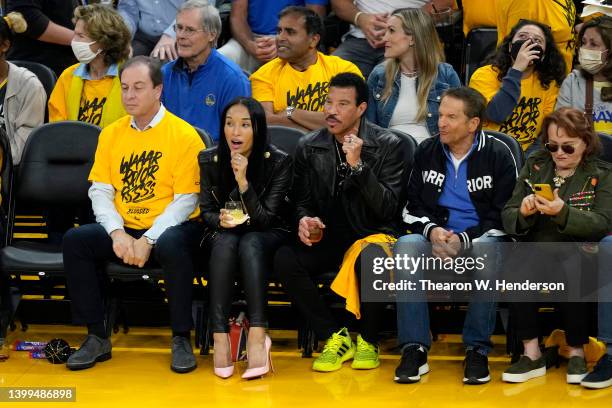 Co-Executive Chairmen of the Golden State Warriors Joe Lacob and Peter Guber and musician Lionel Richie react to a play during the second quarter in...
