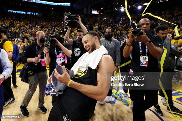 Stephen Curry of the Golden State Warriors celebrates after the 120-110 win against the Dallas Mavericks to advance to the NBA Finals in Game Five of...