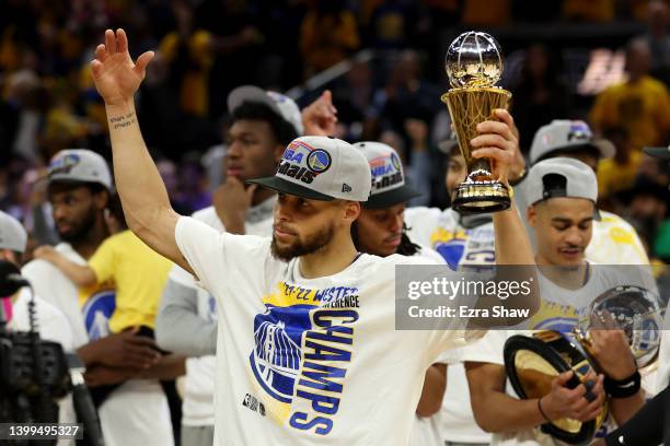 Stephen Curry of the Golden State Warriors celebrates after winning the Magic Johnson Western Conference Finals MVP award after a 120-110 win against...