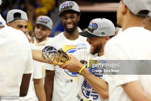 Stephen Curry of the Golden State Warriors celebrates after winning the Magic Johnson Western Conference Finals MVP award after a 120-110 win against...