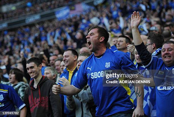 Cardiff City fans celebrate their team's first goal against Liverpool in the League Cup Final at Wembley Stadium in London, on February 26, 2012. AFP...