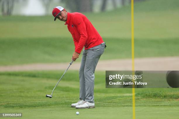 Nick Westrich of the Central Missouri Mules putts the ball during the Division II Men's Golf Championship held at TPC Michigan on May 18, 2022 in...