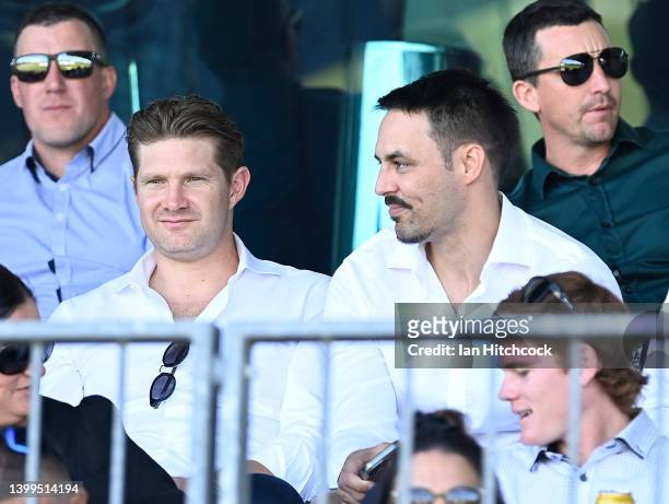Former Australian cricketers Shane Watson and Mitchell Johnson look on during the public memorial service for Andrew Symonds at Riverway Stadium on...