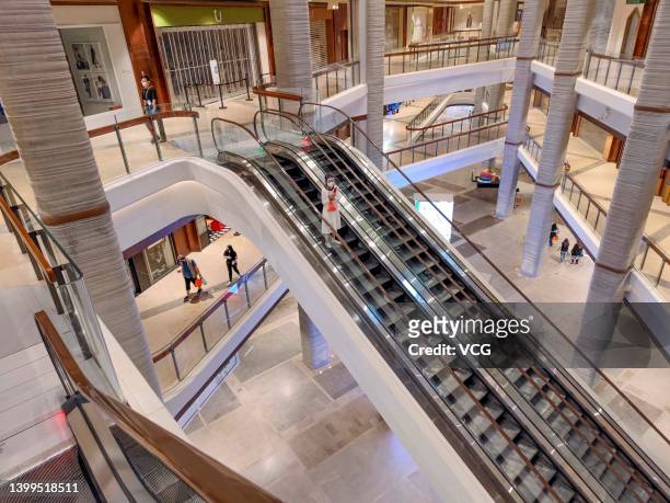 Customer rides an escalator at "1000 Trees" shopping mall in Putuo district on May 26, 2022 in Shanghai, China.