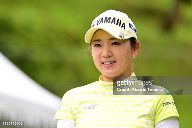 Chie Arimura of Japan smiles on the 10th tee during the second round of Resorttrust Ladies at Maple Point Golf Club on May 27, 2022 in Uenohara,...