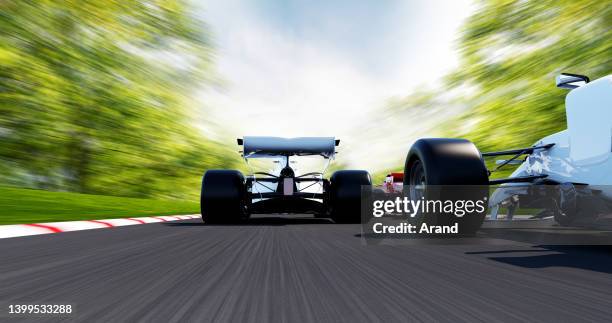 race cars driving on a race track - spoiler stock pictures, royalty-free photos & images