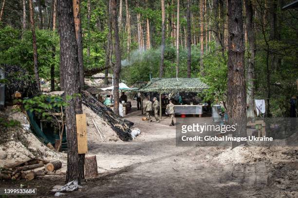Members of Territorial Defense Forces are seen in their military camp in a forest on May 19, 2022 in Kyiv, Ukraine. Russia’s first attack on Kyiv has...