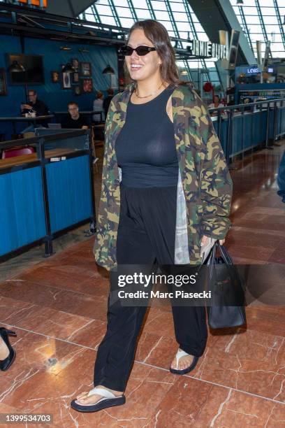 Model Ashley Graham seen arriving ahead of/departing the 75th annual Cannes film festival at Nice Airport on May 27, 2022 in Nice, France.