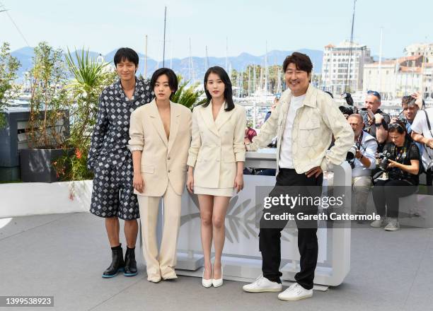 Dong-won Gang, Joo-Young Lee, Ji-eun Lee and Song Kang-ho attend the photocall for "Broker " during the 75th annual Cannes film festival at Palais...