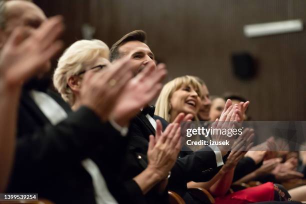 spectators clapping in the theater, close up of hands - gala reception stock pictures, royalty-free photos & images