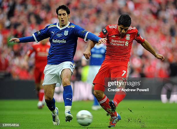 Peter Whittingham of Cardiff City competes with Luis Suarez of Liverpool during the Carling Cup Final match between Liverpool and Cardiff City at...