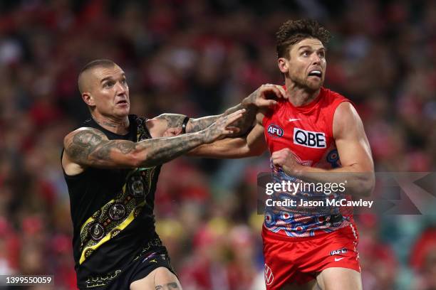 Dustin Martin of the Tigers and Dane Rampe of the Swans compete for the ball during the round 11 AFL match between the Sydney Swans and the Richmond...