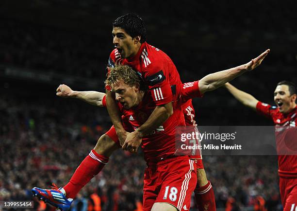 Dirk Kuyt of Liverpool celebrates with Luis Suarez as he scores their second goal during the Carling Cup Final match between Liverpool and Cardiff...