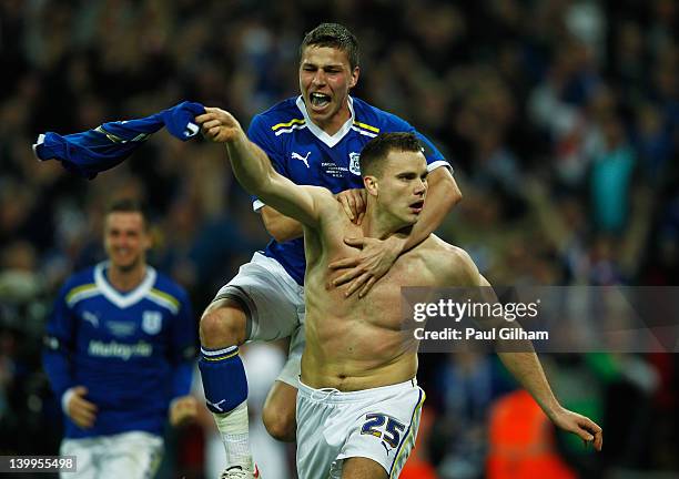 Ben Turner of Cardiff City celebrates with Filip Kiss as he scores their second goal during the Carling Cup Final match between Liverpool and Cardiff...