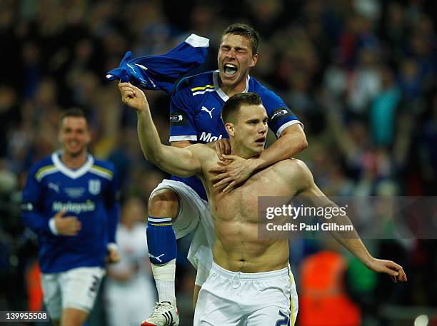 Ben Turner of Cardiff City celebrates with Filip Kiss as he scores their second goal during the Carling Cup Final match between Liverpool and Cardiff...