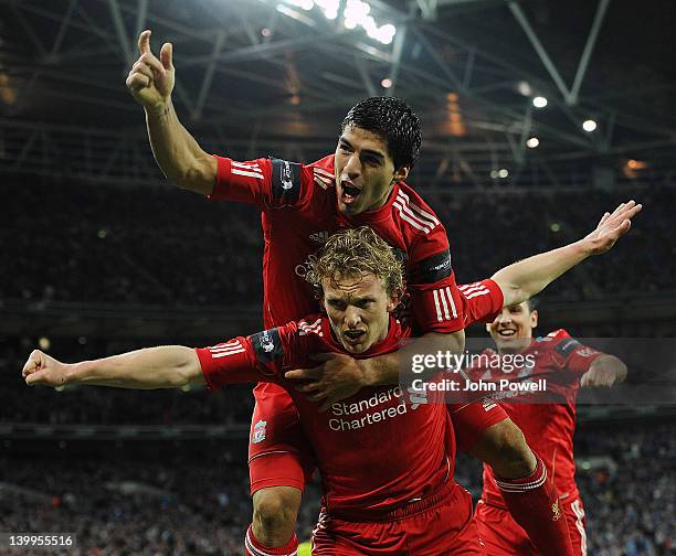 Dirk Kuyt of Liverpool celebrates with team-mate Luis Suarez after scoring a goal during the Carling Cup Final match between Liverpool and Cardiff...