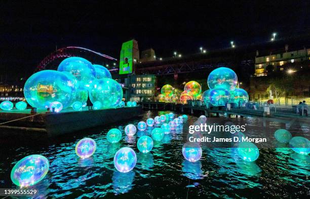 Light installations near the Sydney Harbour Bridge for the opening of the Vivid Sydney festival on May 27, 2022 in Sydney, Australia. The annual...