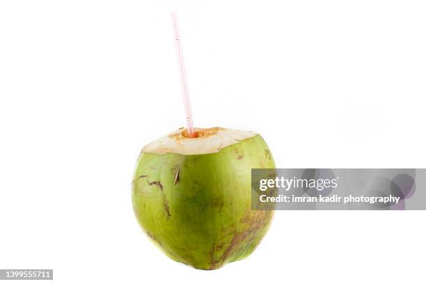 fresh coconut with straw - drinking straw stock pictures, royalty-free photos & images