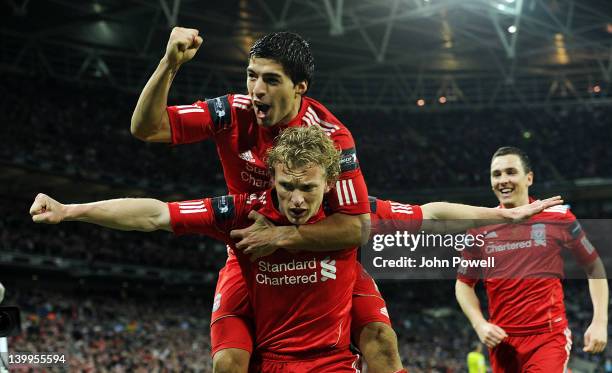 Dirk Kuyt of Liverpool celebrates with team-mate Luis Suarez after scoring a goal during the Carling Cup Final match between Liverpool and Cardiff...
