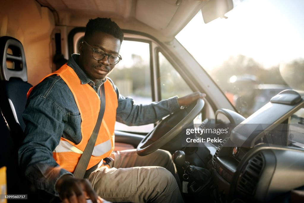 Which Work Delivery Driver Young Delivery Driver At Work High-Res Stock Photo - Getty Images
