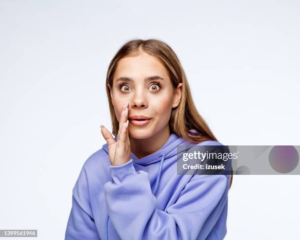excited teenage girl telling secret - people whispering stock pictures, royalty-free photos & images