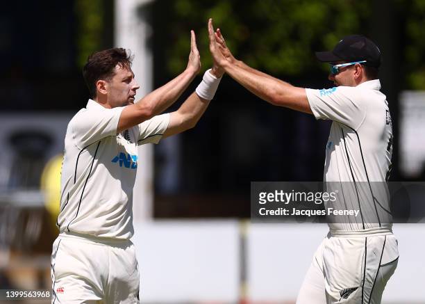 Matt Henry of New Zealand celebrates with Jacob Duffy of New Zealand after bowling out Dom Sibley of First-Class County XI during Day Two of the Tour...