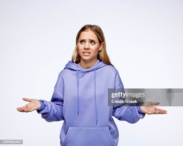 teenage girl with disappointed facial expression - confusion stock pictures, royalty-free photos & images
