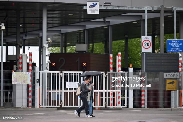 People walk past the border crossing from Estonia into Russia over the Narva River on May 27, 2022 in Narva, Estonia. The town of Narva sits on the...