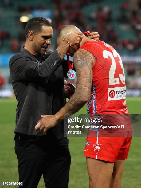 Lance Franklin of the Swans receives the Goodes-O'Loughlin medal from Michael O'Loughlin after winning the round 11 AFL match between the Sydney...