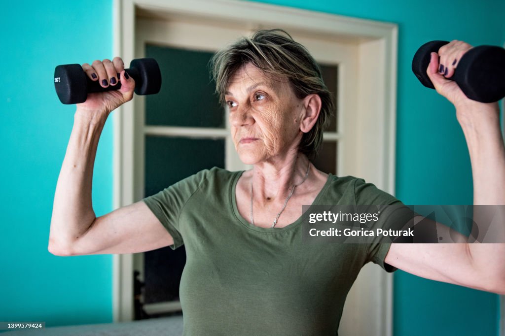 Cropped shot of a senior woman doing strengthening exercises