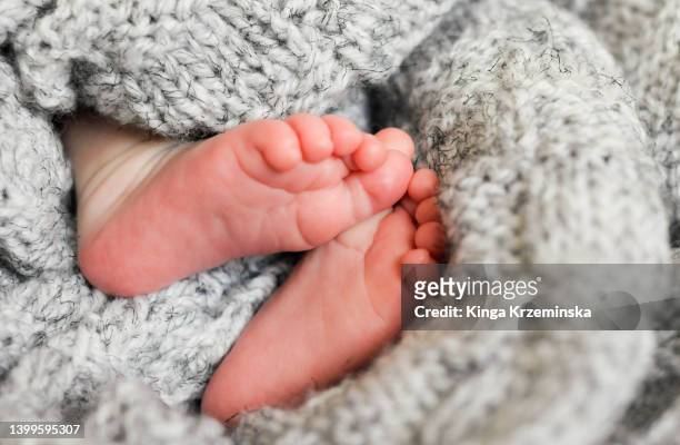 baby's feet - child support stock pictures, royalty-free photos & images