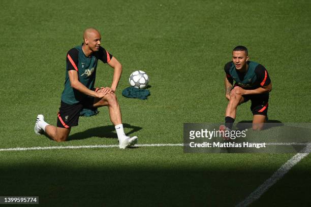 Fabinho and Thiago Alcantara of Liverpool stretch during the Liverpool FC Training Session at Stade de France on May 27, 2022 in Paris, France....