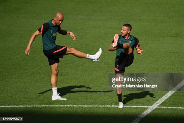 Fabinho and Thiago Alcantara of Liverpool stretch during the Liverpool FC Training Session at Stade de France on May 27, 2022 in Paris, France....