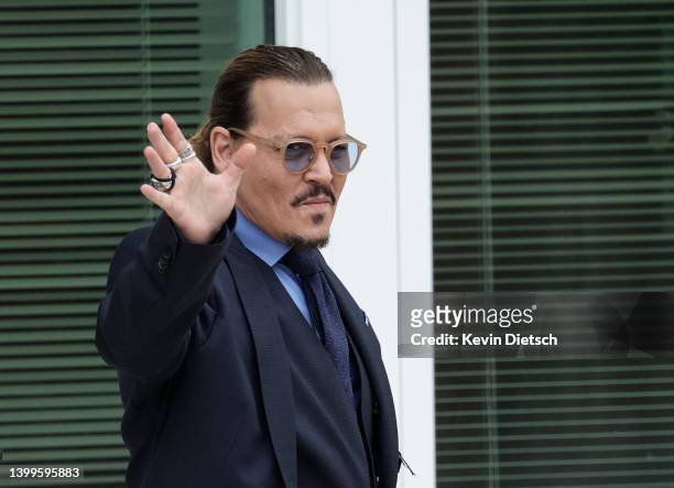 Actor Johnny Depp takes a break during his trial at a Fairfax County Courthouse on May 27, 2022 in Fairfax, Virginia. Closing arguments in the Depp...