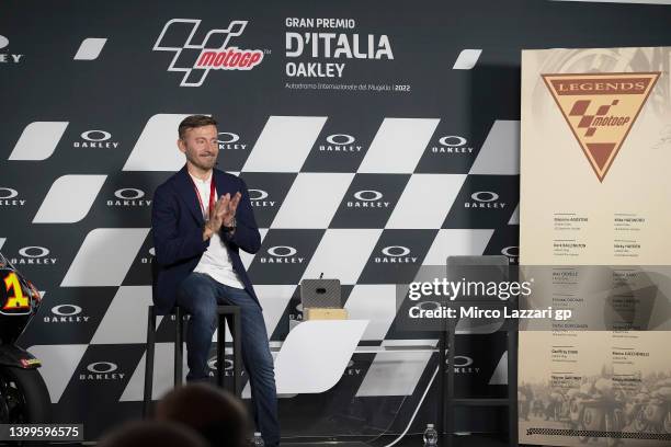 Max Biaggi of Italy smiles and applauds during the "Max Biaggi MotoGP™ Legend Ceremony" in media center during the MotoGP of Italy - Free Practice at...