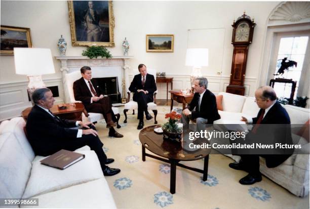 View of, from left, White House Chief of Staff Donald Regan , US President Ronald Reagan , US Vice President George HW Bush , National Security...