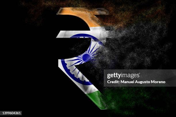 vanishing indian rupee sign with the flag of india - indian economy business and finance stockfoto's en -beelden