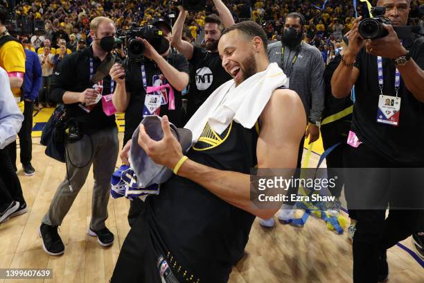Stephen Curry of the Golden State Warriors celebrates after the 120-110 win against the Dallas Mavericks to advance to the NBA Finals in Game Five of...