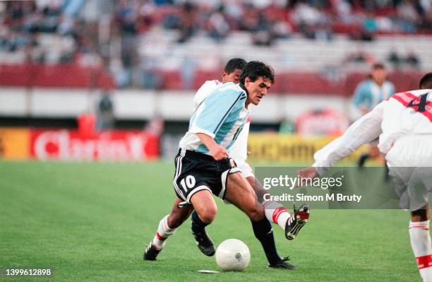 Ariel Ortega of Argentina and Martin Hidalgo of Peru in action during a FIFA World Cup Qualifying match between Peru and Argentina at the Estadio...